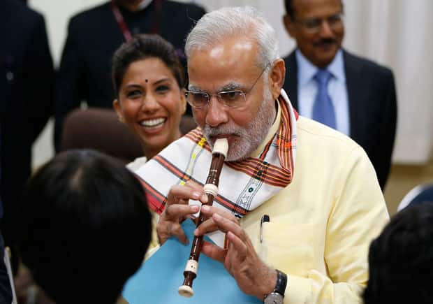 Modi playing the recorder. Reuters