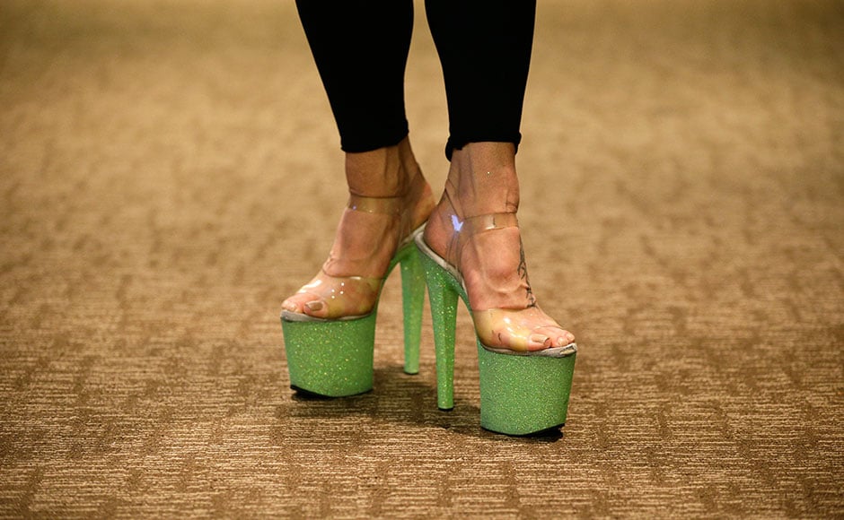 In this Sept. 7, 2014 photo, Jedda J Jordan poses in her high heels after teaching a class at the Pole Expo in Las Vegas. Pole dancers from around the world gathered in Las Vegas this month to swap ideas and learn tricks of the trade. (AP Photo/John Locher)