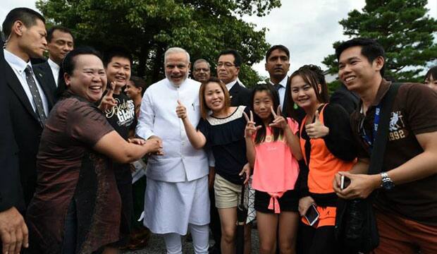 With Thai tourists. Modi's Facebook Fan page