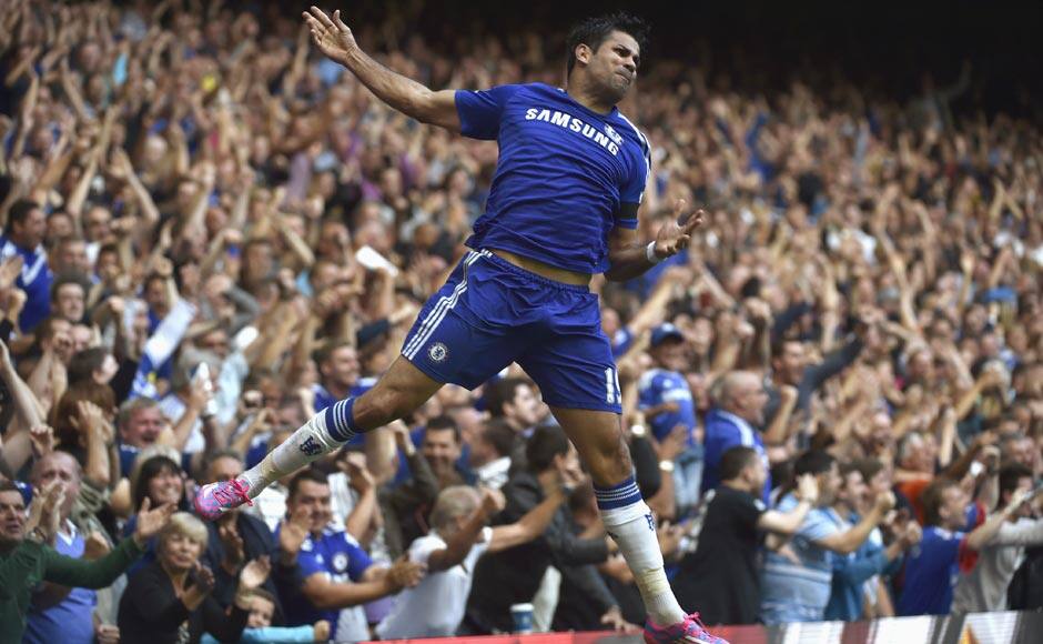 Chelsea's Diego Costa celebrates scoring a second goal against Swansea at the Stamford Bridge. He went on to score a hat-trick as Chelsea overpowered Swansea 4-2. Costa has now scored seven times in four appearances and has become the first player to score seven Premier League goals in his opening four matches for a side in EPL history. Reuters