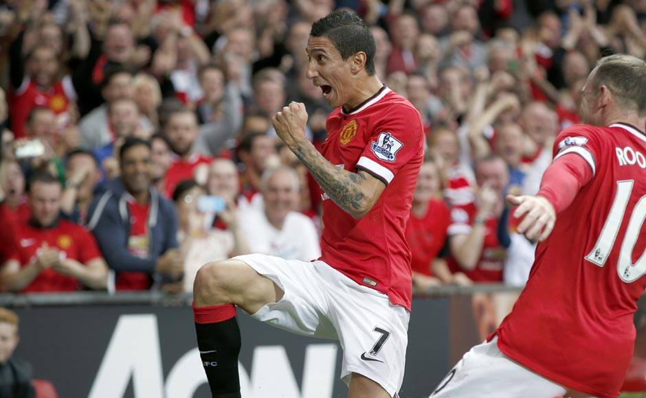 Manchester United's Angel Di Maria (L) celebrates with teammate Wayne Rooney after scoring a goal against Queens Park Rangers. Di Maria had a brilliant outing with one goal, one shot, three chances created, two take ons and 80% pass accuracy. Reuters 
