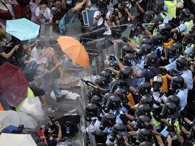 Hong Kong Pro-Democracy Movement: Police use tear gas on protesters  Hong Kong Pro-Democracy Movement: Police use tear gas on protesters