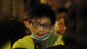 Hong Kong police barricade streets  to block in thousands of protesters