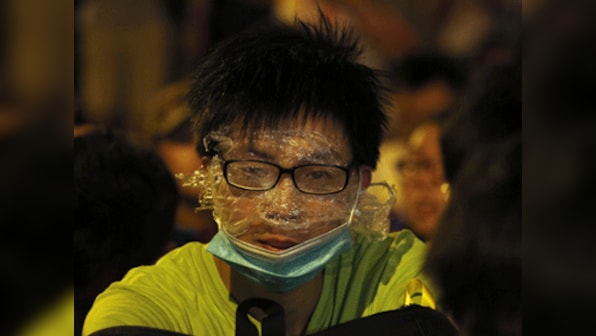 Hong Kong police barricade streets  to block in thousands of protesters