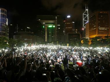 Pro-democracy protesters switch on their mobile phones during a campaign to kick off the Occupy Central civil disobedience event in front of the financial Central district in Hong Kong. Reuters image