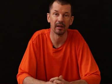 An image grab taken from a video released by the Islamic State (IS) group through Al-Furqan Media via YouTube on September 18, 2014, allegedly shows British freelance photojournalist, John Cantlie, at an undisclosed location. AFP 