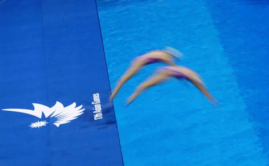 Members of Macau's synchronised swimming team dive into a pool during a practice session at Munhak Park Tae-hwan Aquatics Center ahead of the 17th Asian Games in Incheon September 17, 2014. Reuters