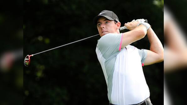 Bang on target: Rory McIlroy's tee shot lands in spectator's pocket