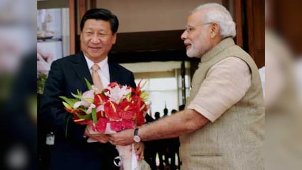  India, China sign three pacts within hours of Xi's arrival