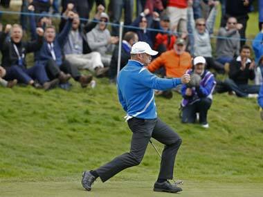 Jamie Donaldson pumps his fist after making a putt. Reuters
