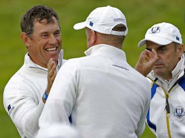 Lee Westwood (left) celebrates with playing partner Jamie Donaldson. Reuters