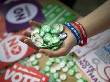No thanks badges are seen ahead of the voting in Scotland. AP 