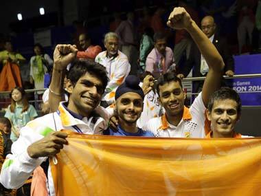India's men's squash team celebrates after winning gold. Getty Sports Images
