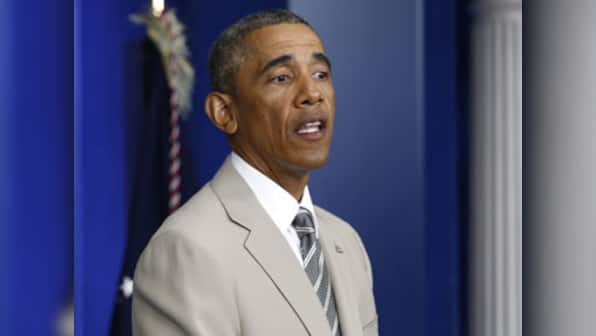 Despite Twitter outrage, Obama backs his choice of  tan suit