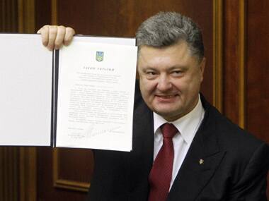 Ukraine's President Petro Poroshenko shows a signed landmark association agreement with the European Union during a session of the parliament in Kiev. Reuters image