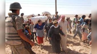 About 60,000 Syrian Kurds flee to Turkey from Islamic State advance