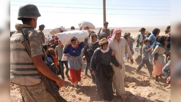 About 60,000 Syrian Kurds flee to Turkey from Islamic State advance