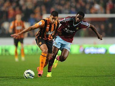 Hull City's Hatem Ben Arfa, left, and West Ham United's Alex Song battle for the ball. Reuters