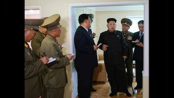 Photos: Kim Jong-un limps back to public view, with a cane