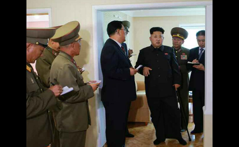 Photos: Kim Jong-un limps back to public view, with a cane Photos: Kim Jong-un limps back to public view, with a cane