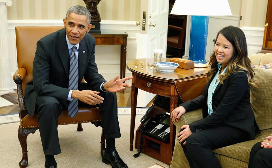 U.S. President Barack Obama talks with Dallas nurse Nina Pham at the Oval Office in Washington, October 24, 2014. Pham, who contracted the disease while treating a man who later died of Ebola in a Dallas hospital, had been undergoing treatment at the National Institutes of Health in Bethesda, Maryland, since Oct. 16. REUTERS