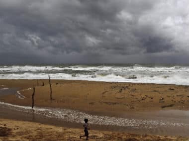 A  boy plays on the beach as waves break on the Bay of Bengal coast near Gopalpur, in Ganjam district, 140 kilometers (87 miles) south of Bhubaneswar. AP
