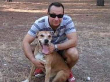 This is an undated image released on Wednesday Oct. 8, 2014 by animal rights organisation PACMA of Javier Limon, husband of the nurse assistance who is infected with Ebola in Madrid, with his dog named Excalibur. AP 