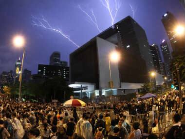 Lightning is seen during a rally near government office in Hong Kong. AP 