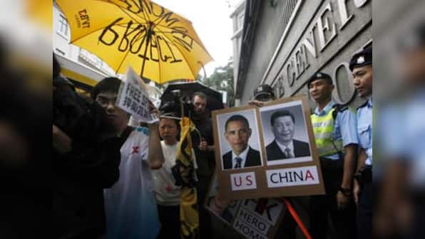 Hong Kong police start removing barricades, protesters caught unaware