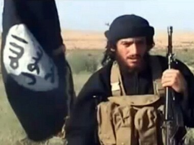 An image grab taken from a video uploaded on YouTube on July 8, 2012, shows the spokesman for the Islamic State of Iraq and the Levant (ISIL), Abu Mohammad al-Adnani al-Shami, speaking next to an Al-Qaeda-affiliated flag at an undisclosed location. AFP