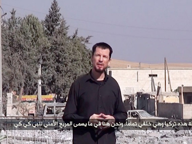 Video shows British hostage 'reporting' for Islamic State Video shows British hostage 'reporting' for Islamic State