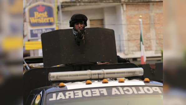 Federal agents take over city in Mexico after discovery of mass grave