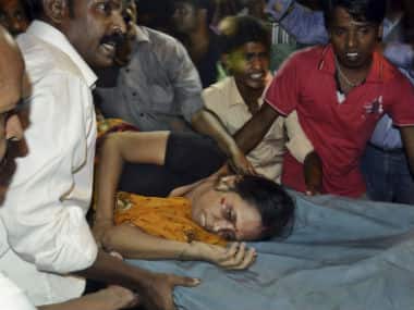 An Injured woman is carried on a stretcher to a hospital for treatment in Patna. AP 