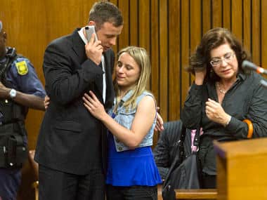 Pistorius is greeted by a supporter after the first day of his sentencing hearing at the North Gauteng High Court. Reuters