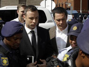 Oscar Pistorius arrives at the high court in Pretoria, South Africa for his sentencing hearing today. AP 