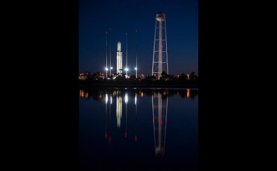 The Orbital Sciences Corporation Antares rocket, with the Cygnus spacecraft onboard, is seen on the launch pad at NASA's Wallops Flight Facility in Virginia in this October 26, 2014 NASA handout photo. The Antares will launch with the Cygnus spacecraft filled with over 5,000 pounds of supplies for the International Space Station October 27, 2014. REUTERS/NASA/Joel Kowsky/Handout via Reuters 