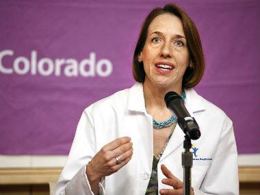 Children's Hospital Colorado pediatric neurologist Teri Schreiner, MD, speaks during a press conference at the hospital September 30 to update the media on the condition of 10 patients with respiratory enterovirus EV-D68. AFP