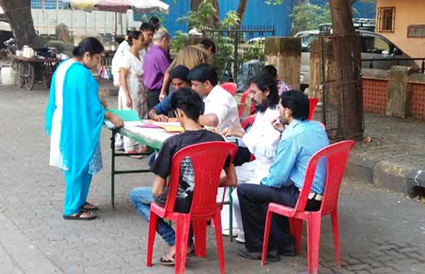 Voters checking their names on the electoral roll. Parag Shinde/Firstpost