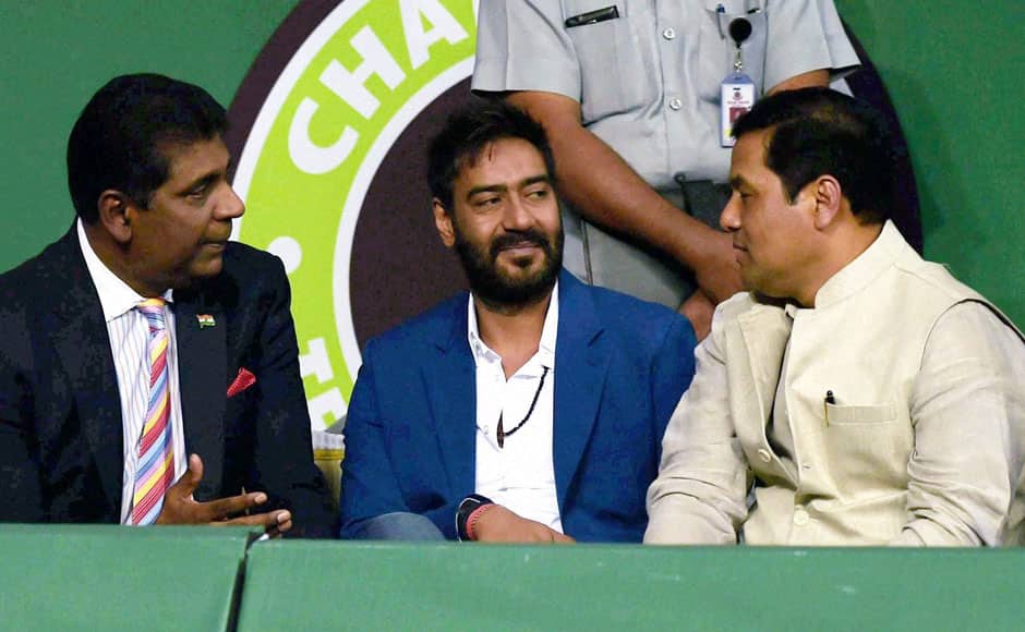 Sports Minister Sarbananda Sonowal, former Tennis player Vijay Amritraj and actor Ajay Devgn during Champions Tennis League in New Delhi. PTI