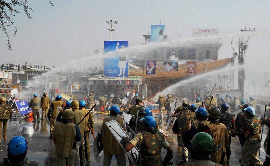Hisar: Police and Sant Rampal’s followers indulge in violent clashes at Satlok Ashram in Hisar on Tuesday. Supporters of Rampal indulged in clashes with the police to resist his arrest. PTI