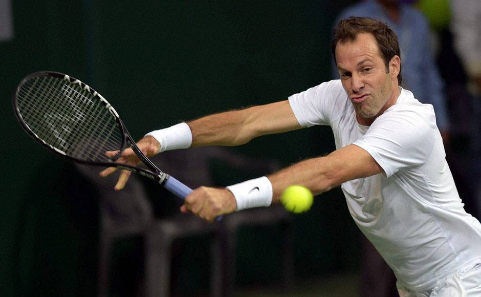 Punjab Marshalls' Greg Rusedski in action against Delhi Dreams' Juan Carlos Ferrero during the Men's singles match. Rusedski was thumped 1-6 by Ferrero as Delhi took a 1-0 lead. PTI