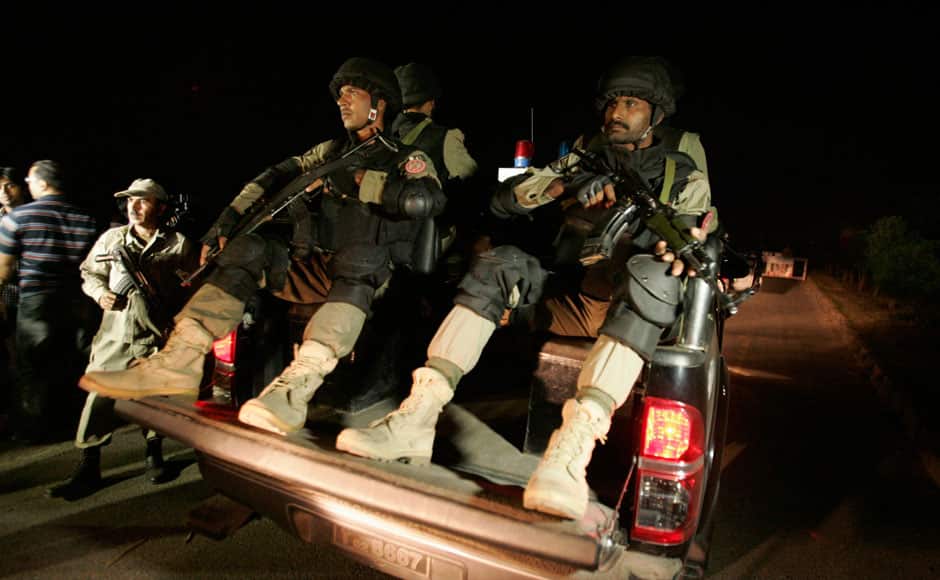 Pakistani soldiers patrol on a vehicle after a suicide bomb attack in Wagah border near Lahore November 2, 2014. At least 45 people were killed on Sunday when a suicide bomber blew himself up on the Pakistani-Indian border, police said, just after a daily ceremony when troops from both sides simultaneously lower the two nations' flags. REUTERS
