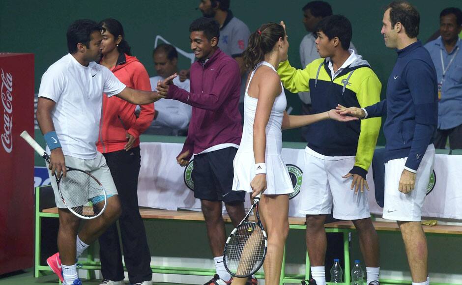 Punjab Marshalls' Garbine Muguruza and Leander Paes celebrate with teammates after winning the set against Delhi Dreams' Jelena Jankovic and Kevin Anderson at the Mixed doubles of Champions Tennis League. PTI