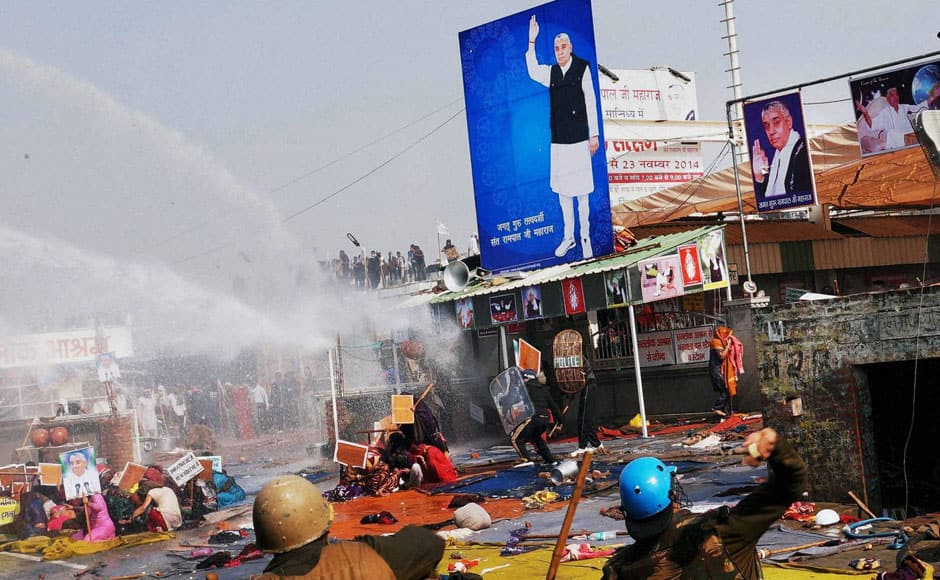 Hisar: Police use batons and water cannon to disperse supporters of controversial guru Sant Rampal outside Satlok Ashram in Hisar on Tuesday. Supporters of Rampal indulged in clashes with the police to resist his arrest. PTI 