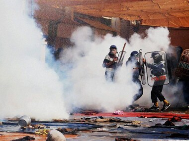 Police use tear gas shells and lathi charge on Rampal's supporters during the clash. PTI