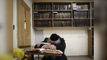 Jerusalem mourns as Israel vows harsh response to synagogue attack