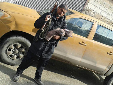 Shocking: Indian-origin Islamic State member poses with AK-47 and his new born Shocking: Indian-origin Islamic State member poses with AK-47 and his new born
