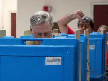 Viral pic: Senate leader Mitch McConnell photobombed by voter