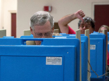 Viral pic: Senate leader Mitch McConnell photobombed by voter  Viral pic: Senate leader Mitch McConnell photobombed by voter