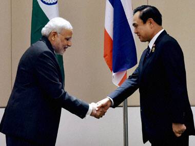 Prime Minister Narendra Modi shakes hands with Thai Prime Minister Gen Prayuth Chan-ocha. PTI